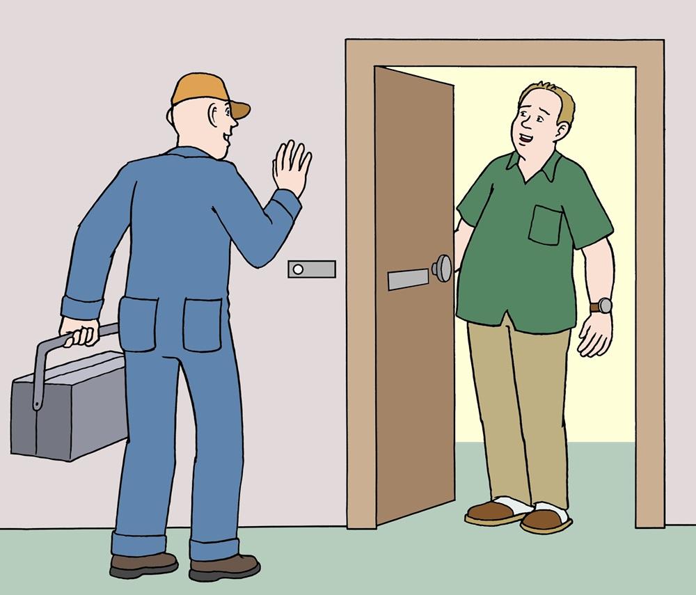 Handwerker an einer Haustür