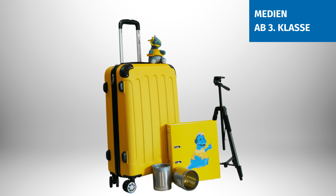 Der gelbe Medienkoffer mit Ordner, Stativ und Plüschdino