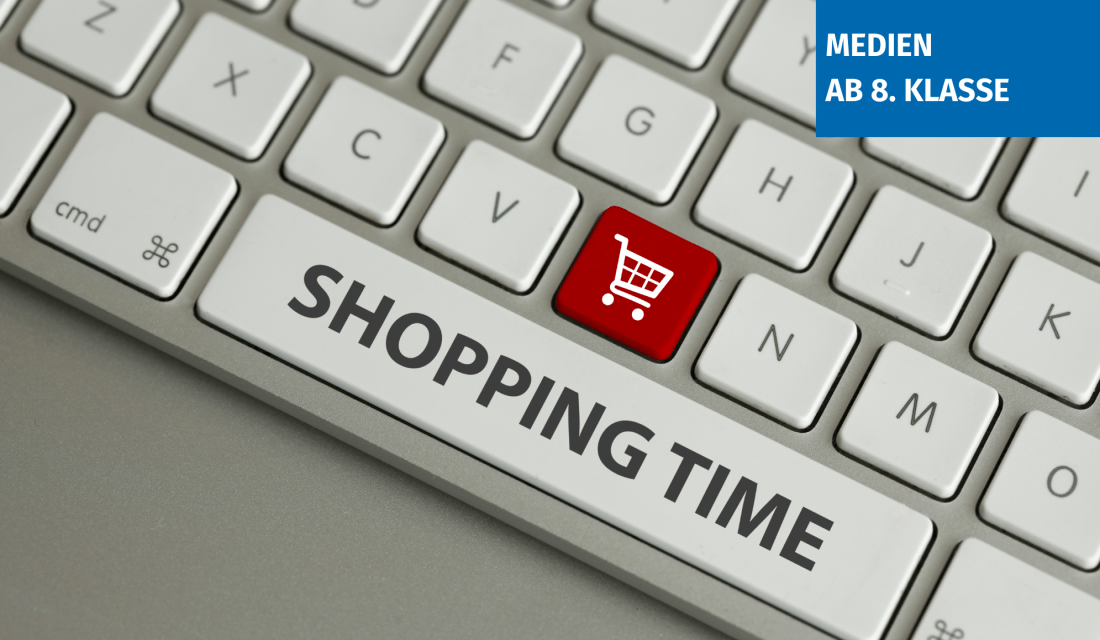 Ein Ausschnitt einer grauen Tastatur, auf der Leertaste steht Online Shopping und eine Taste ist rot mit einem weißen Einkaufswagensymbol