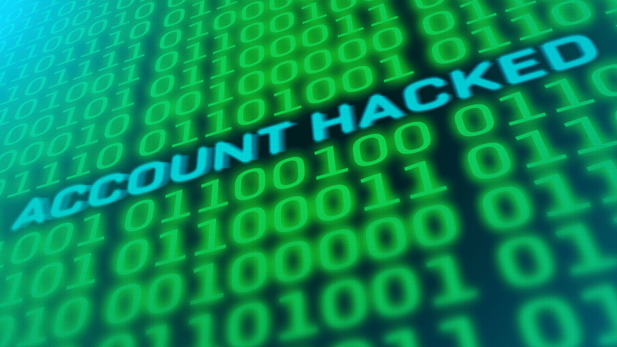 Das Bild zeigt einen Computerbildschirm mit dem Schriftzug "Account hacked" inmitten angeordneter Einsen und Nullen