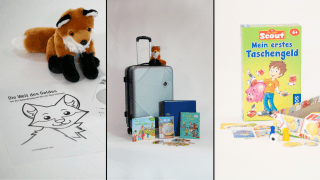 Der graue Finanzkoffer mit allerlei Material, ein Plüschtierfuchs und ein Spiel für Kinder